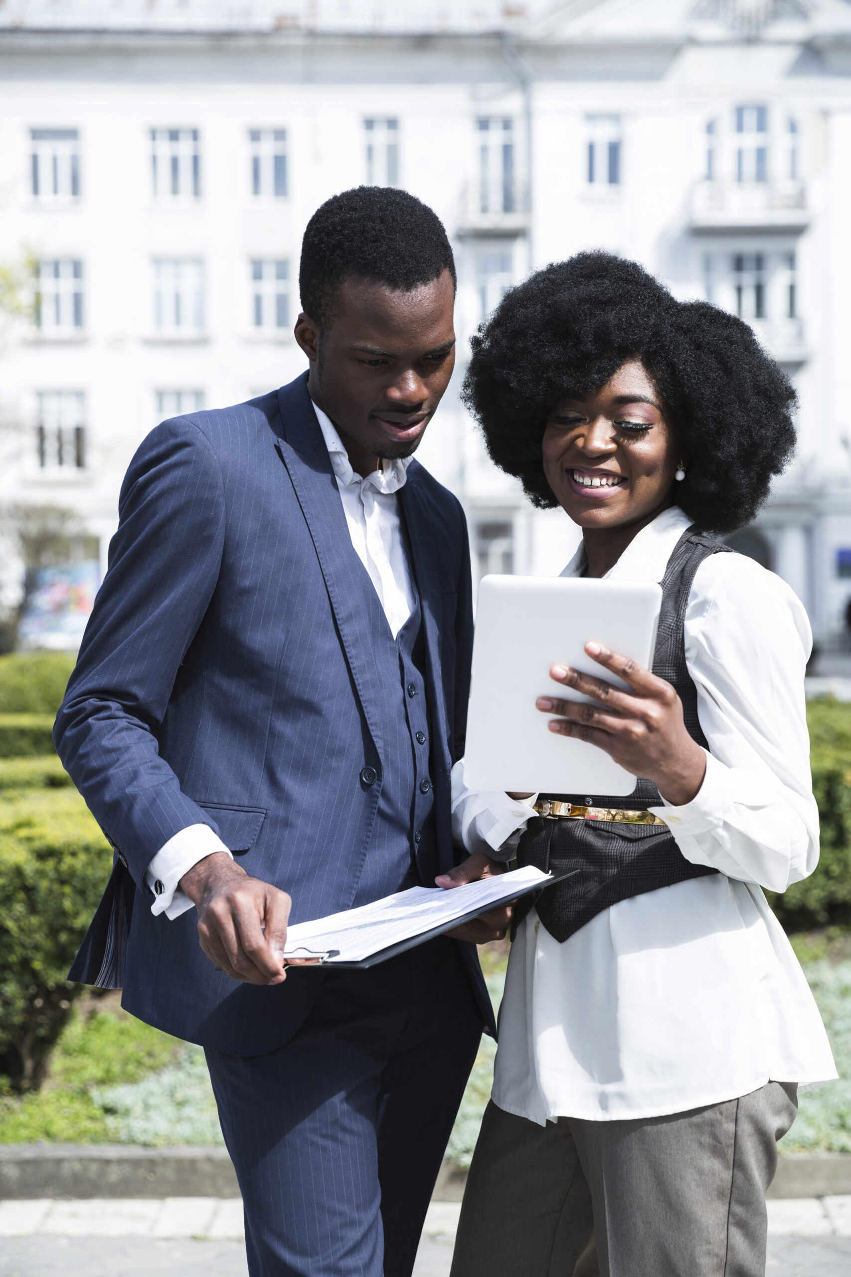 portrait african young businessman businesswoman looking digital tablet